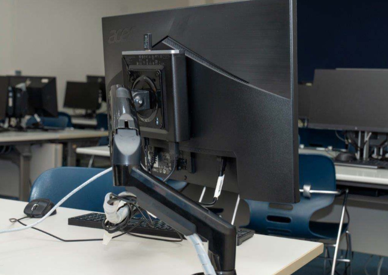 Adjustable monitor arm and 27-inch display to enhance ergonomic access and visibility.