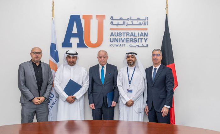 Image of AU and Waves members after signing MOU