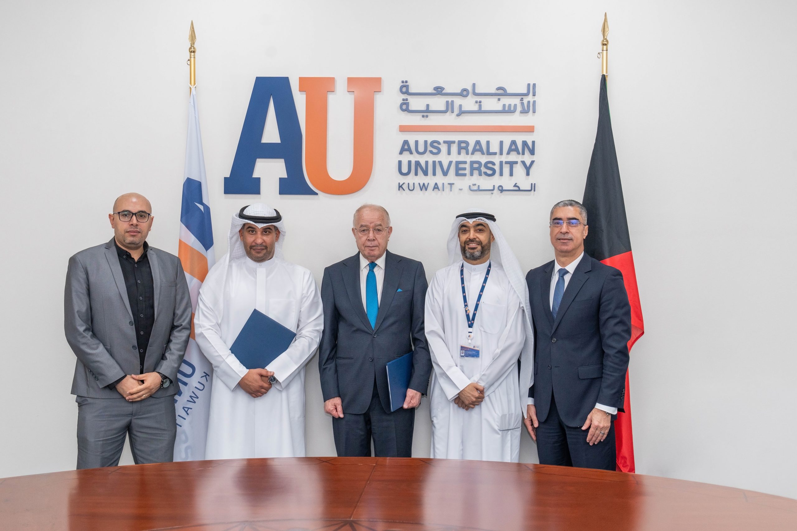 news-AU-signs-MOU-with-Waves Image of AU and Waves members after signing MOU