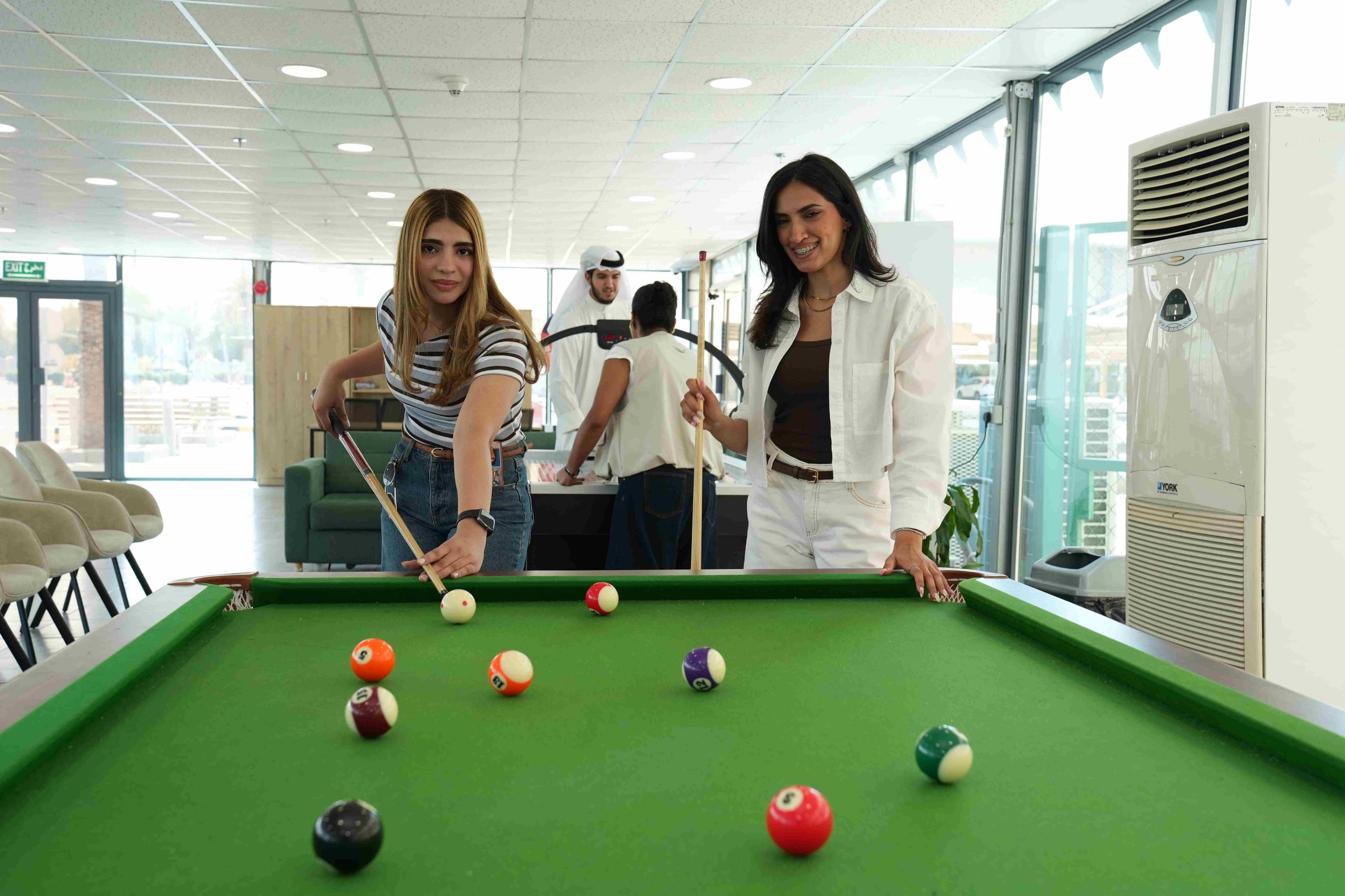 Students playing pool at the Student Engagement Centre