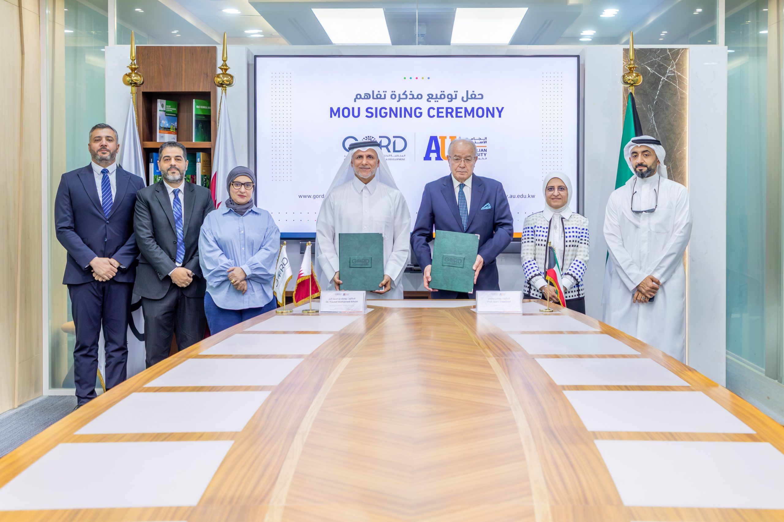 au-gord-agreement-signing-2026 AU President Prof. Isam Zabalawi and GORD Founding Chairman Dr. Yousef Al Horr at the cooperation agreement signing ceremony in Doha, Qatar.