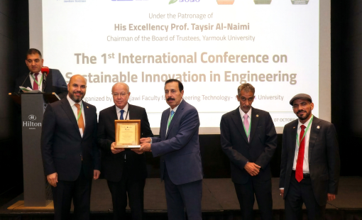 ICSIE 2026 opening ceremony at Yarmouk University with conference representatives during an award presentation