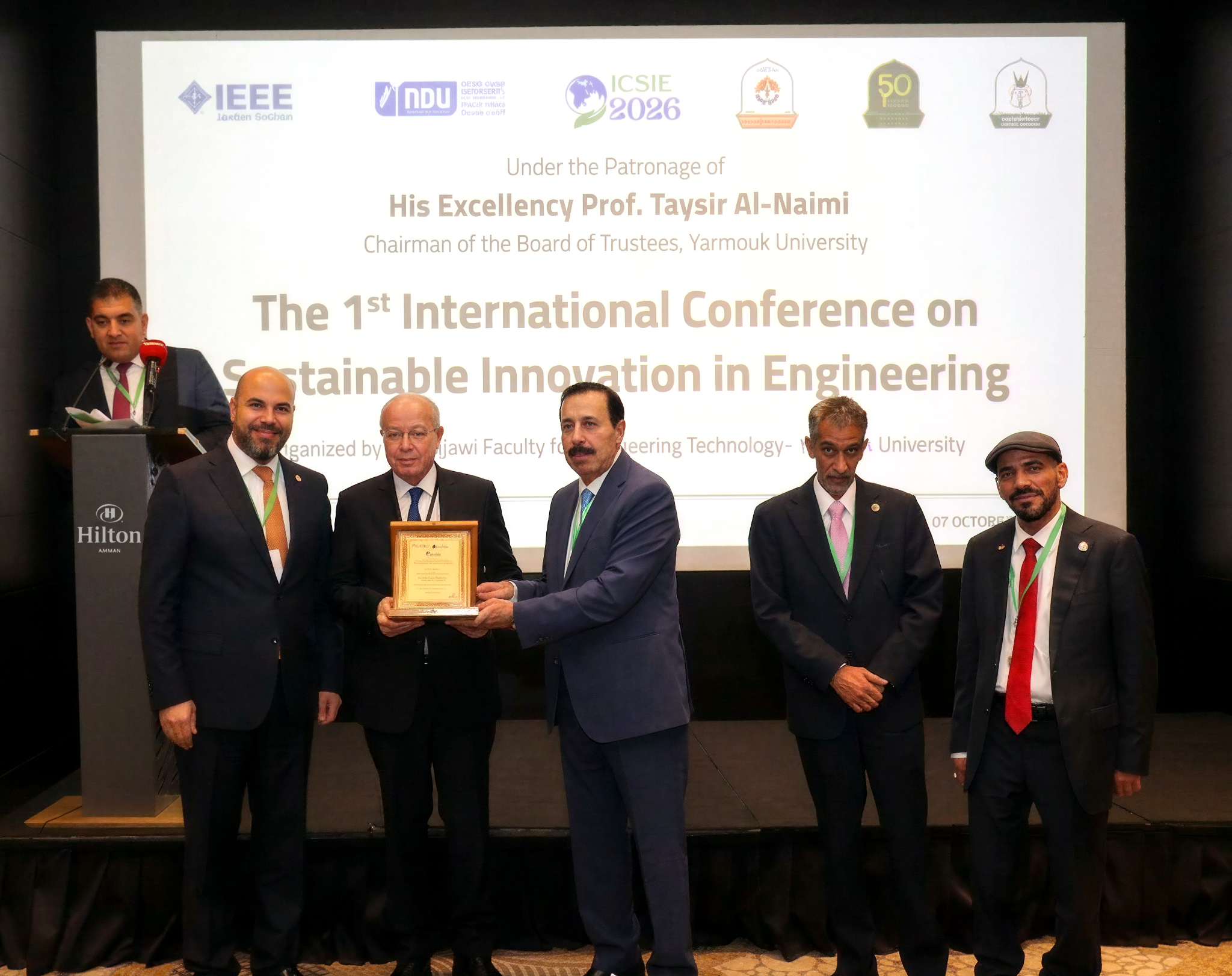 icsie-2026-opening-ceremony-yarmouk-university ICSIE 2026 opening ceremony at Yarmouk University with conference representatives during an award presentation